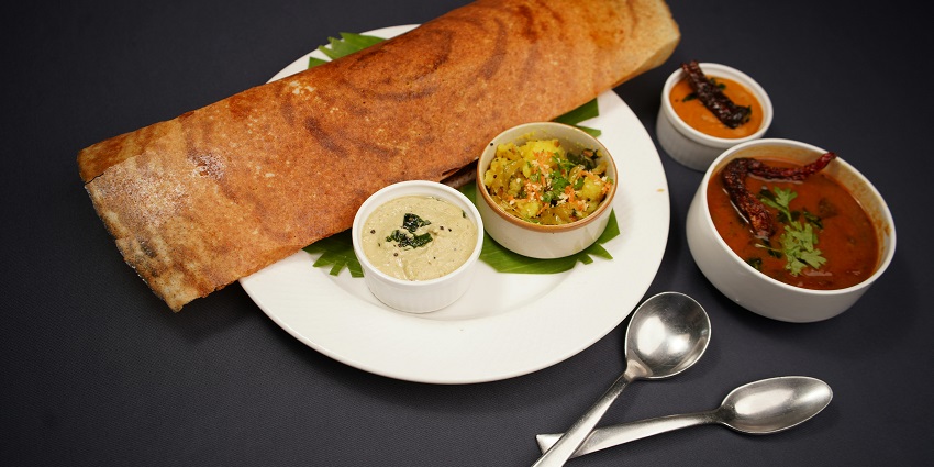 Dosa with chutney and sambar served at Hasty Tasty, one of the popular restaurants in Silchar.
