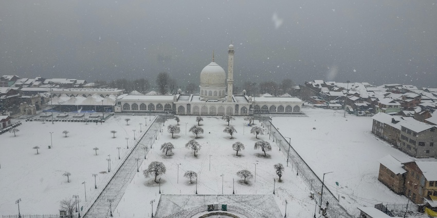 Hazratbal shrine from above with its courtyards and surrounding, showing snowfall in Srinagar.