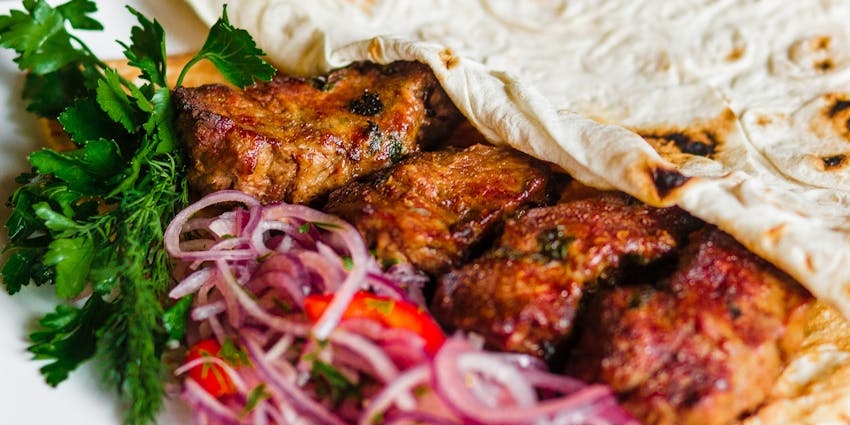 Kebabs served on a plate at House Of Madira restaurant.