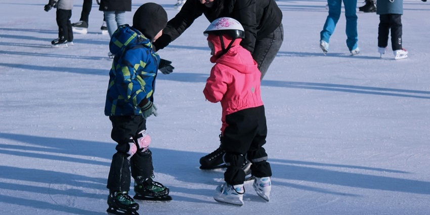 Frozen rinks filled with skaters gliding gracefully amid the scenic Himalayan snow.