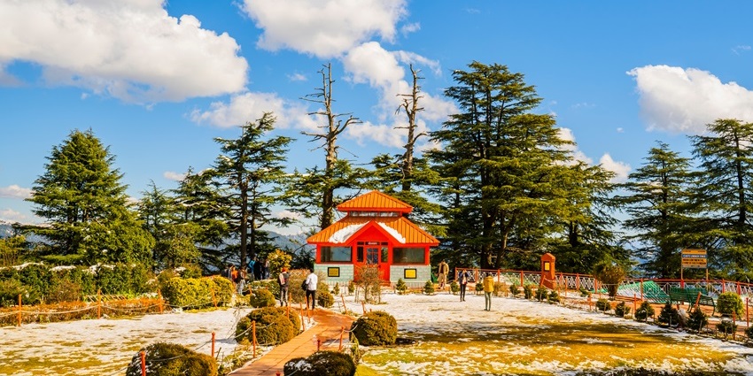 Jakhoo Temple in Shimla is surrounded by tall trees and offers scenic hilltop views.