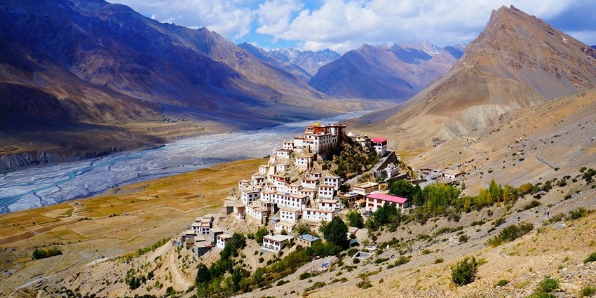 Key Monastery perched atop a hill in Lahual Valley, surrounded by snow-capped peaks.