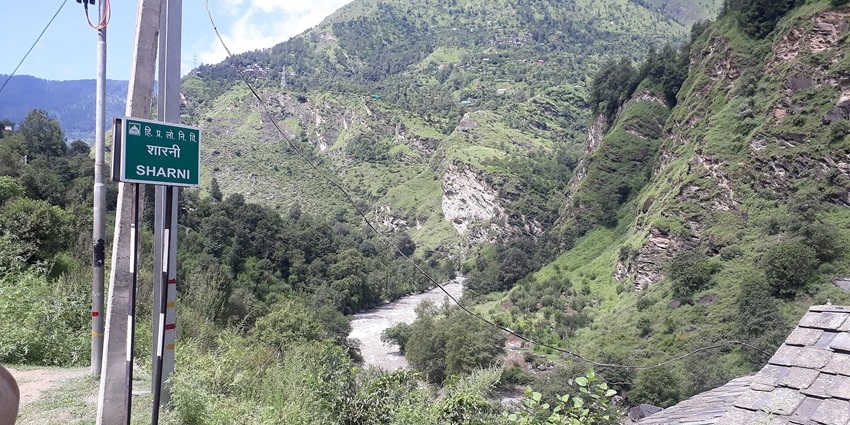 Green hills and a river flowing through Parvati Valley near Kasol, Kullu district, , showing snowfall in Kasol.