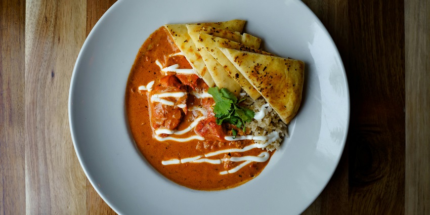 Butter chicken with flatbread served at Mannat Hill View Dhaba, one of the restaurants in Beltola Guwahati.
