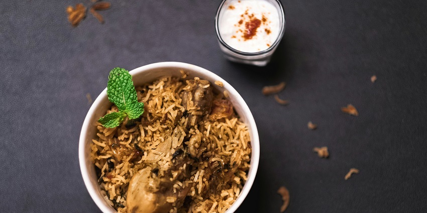 Chicken biryani with raita at Masle Mix Dine, one of the popular restaurants in Six Mile Guwahati.
