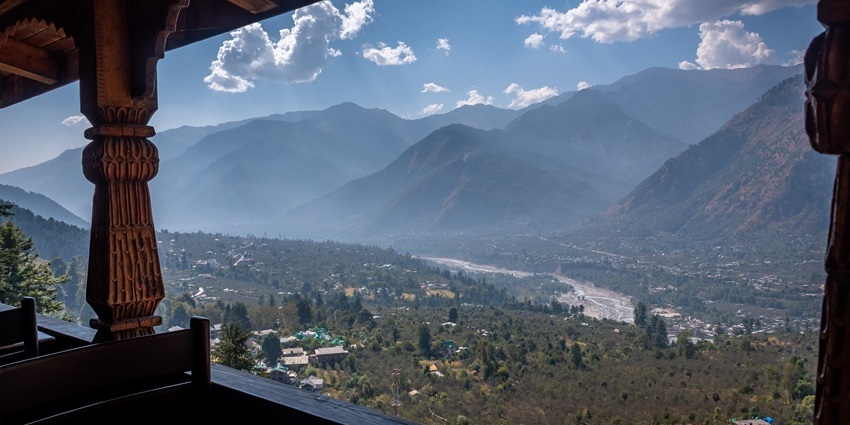Naggar Castle's traditional wooden architecture overlooking Kullu Valley's landscape.