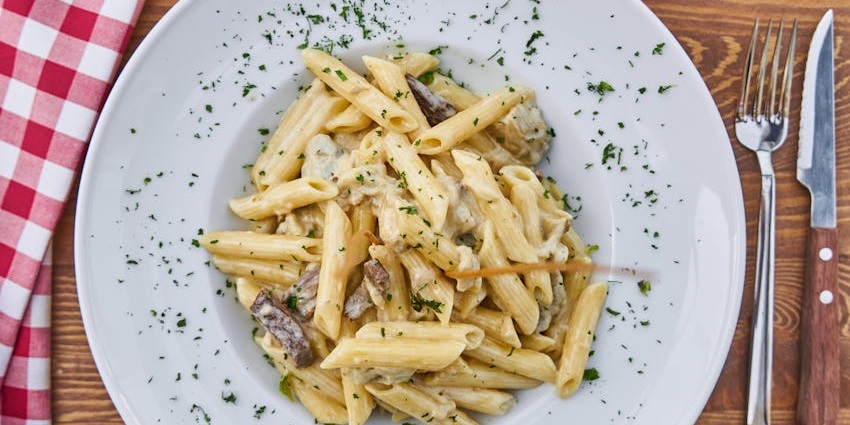White sauce pasta served at Olive Garden Rooftop Restro Cum Bar.