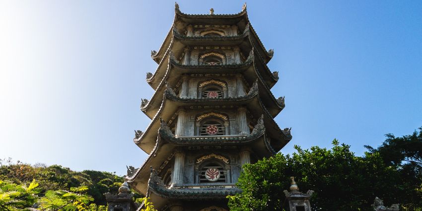 A scenic view of a towering temple, surrounded by greenery, nestled in Vietnam.
