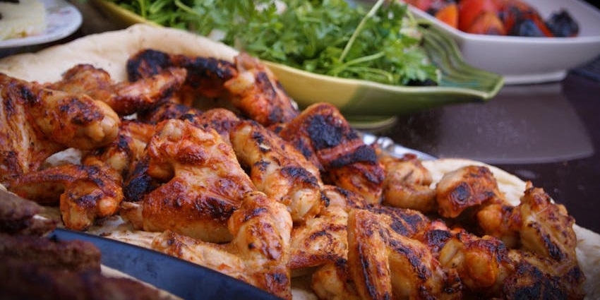 Grilled chicken served at Pirates Of Grill on a dining table.