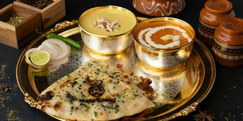 Indian thali with dal and naan served at Rasoi Ghar, one of the top restaurants in Silchar.
