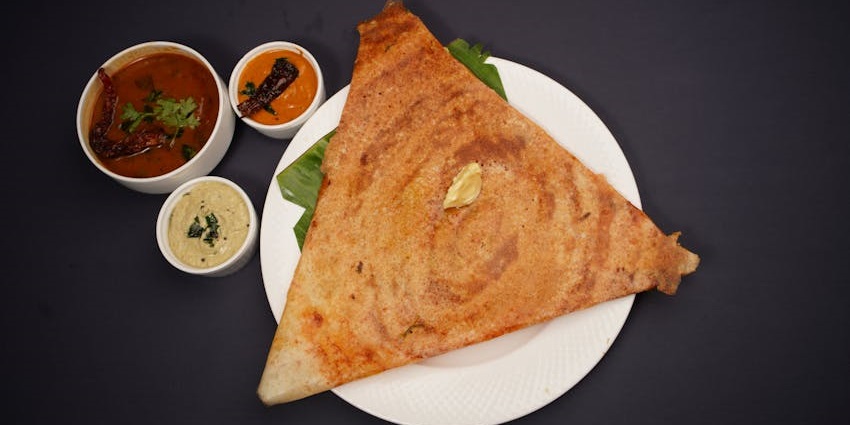 Dosa served with sambhar and chutneys at Sagar Ratna, one of the best veg restaurants in Guwahati.