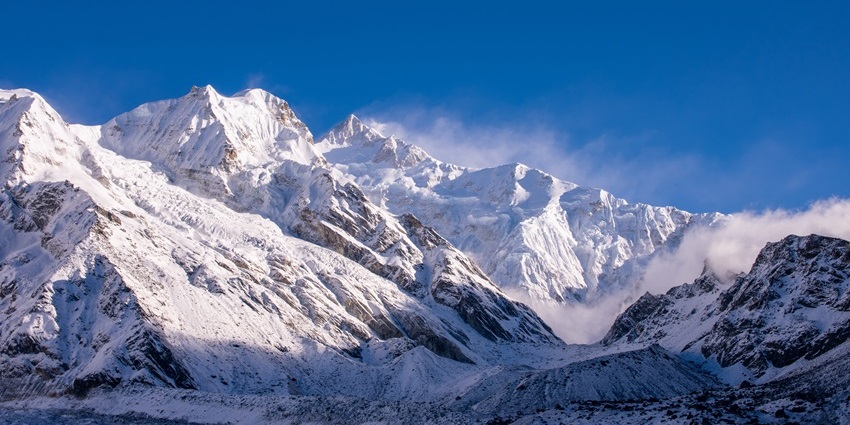 A jaw-dropping view of Mt. Kanchenjunga with a thick blanket of snow viewed from Sikkim.