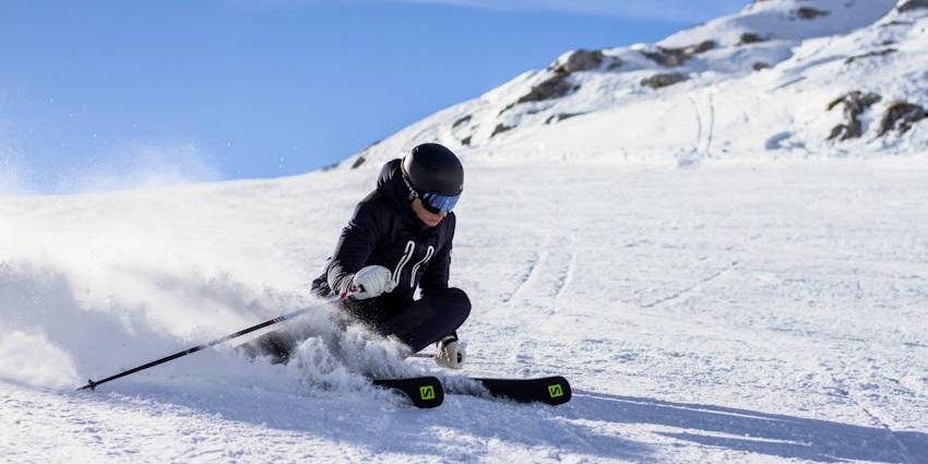 Tourists enjoying thrilling skiing and snowboarding on pristine snow slopes.