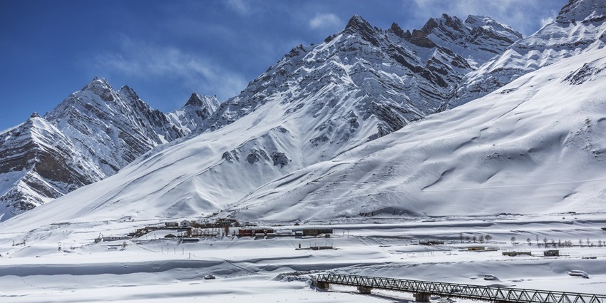 Scenic image of the spiti valley in winter surrounded by snow laden hills—Snowfall In North India