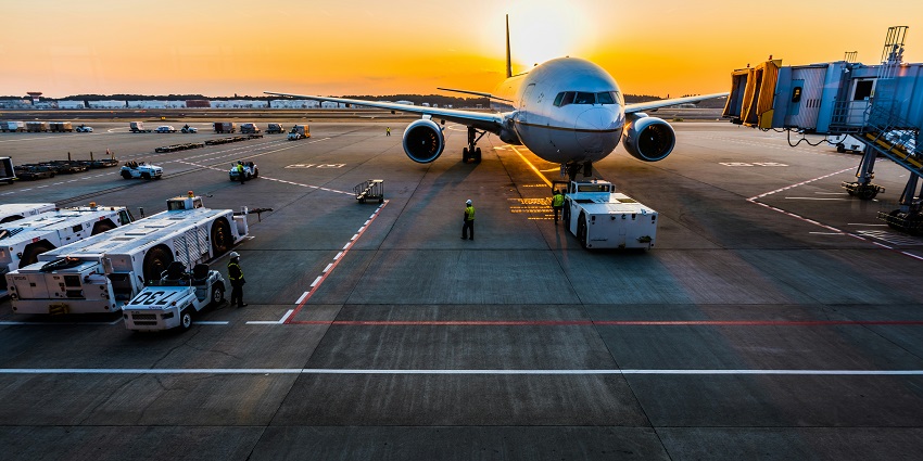 Airplane on runway during sunset at Srinagar International Airport, one of the airports in Kashmir.
