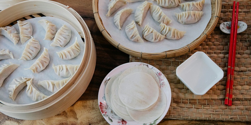 Steamed veg momos served in a wooden box at the Corner Cafe, one of the cafes in Uzan Bazar Guwahati.