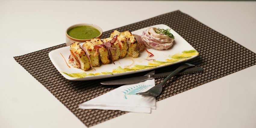 Paneer tikka served on a platter at The Great Kabab Factory restaurant.
