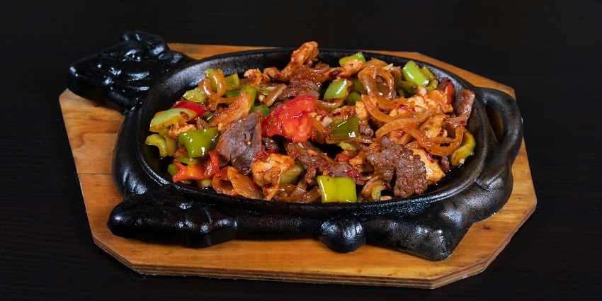 Chicken sizzler served at The Rhapsody Bistro Cafe in Zoo Road, Guwahati.
