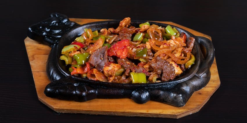 Meat sizzler served at The Root Barrel, one of the famous rooftop restaurants in Guwahati.