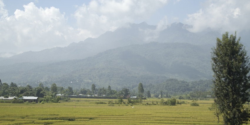 Panoramic view of the Imphal Valley in Manipur, showcasing lush green fields