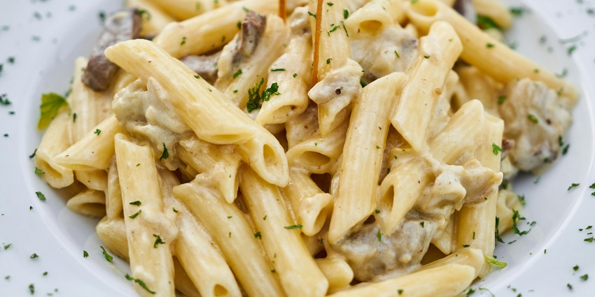 Creamy white sauce pasta served at Tipsy Town Cafe, one of the cosy cafes in Zoo Road Guwahati.

