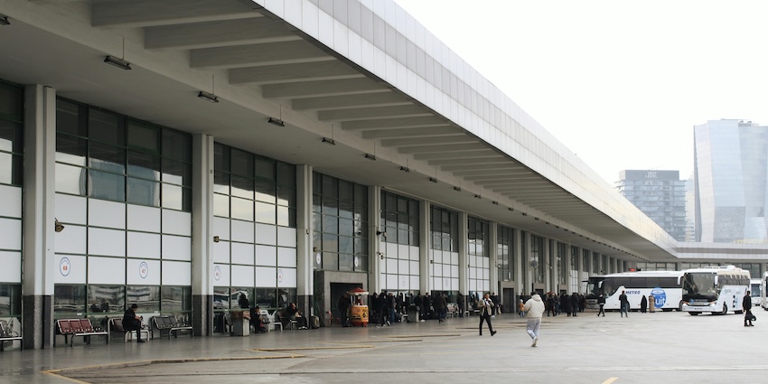 Passengers waiting near buses outside a modern city bus terminal in airports in Tripura.