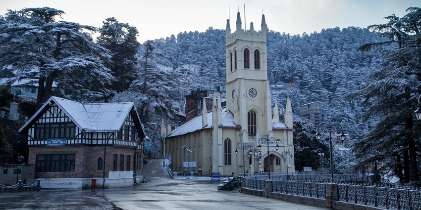 Snowfall in Shimla at Christ Church, with its iconic stained glass windows and colonial architecture.