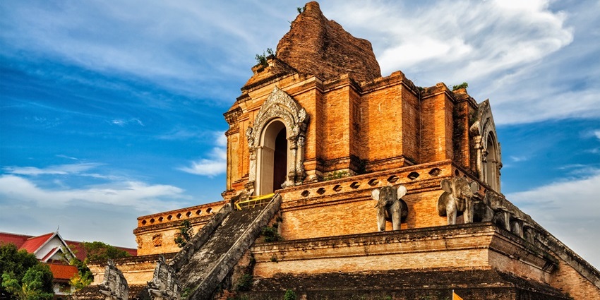 Exterior view of the Wat Chedi Luang with traditional architecture at Chiang Mai, Thailand.