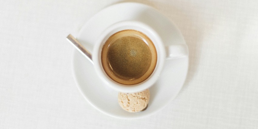 A cup of espresso is served with a sugar cube at Zongri Bakery And Cafe, one of the famous cafes in MG Marg Gangtok.